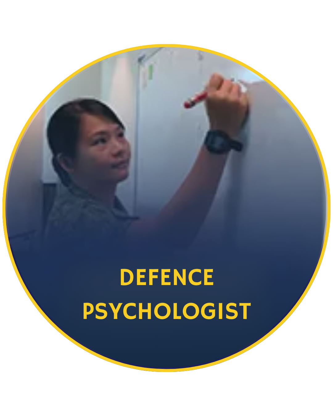 SAFVC defence psychologist writing on a whiteboard during a planning or training session indoors.